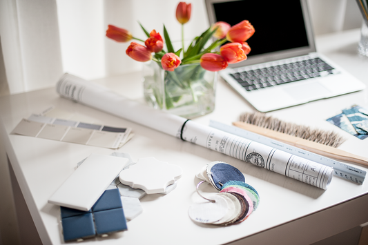 Interior designer desk with spring tulips and material samples —  spring home refresh — A Design Lifestyle