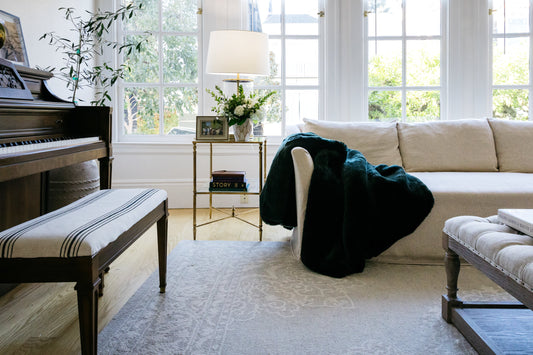 Warm winter living room with layered textiles and candlelight —  winter home guide — A Design Lifestyle